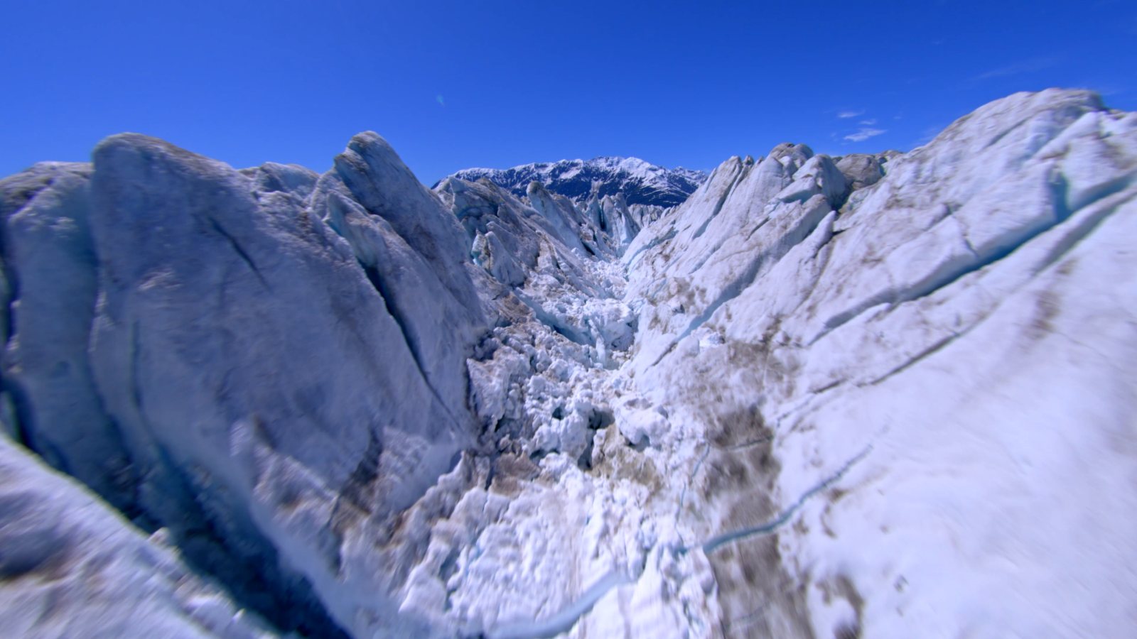 Flying past a knife-edge peak above the icefield